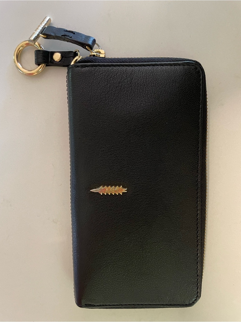 Black Leather Thacker Zip Wristlet Clutch with Gold Arrow Accent
